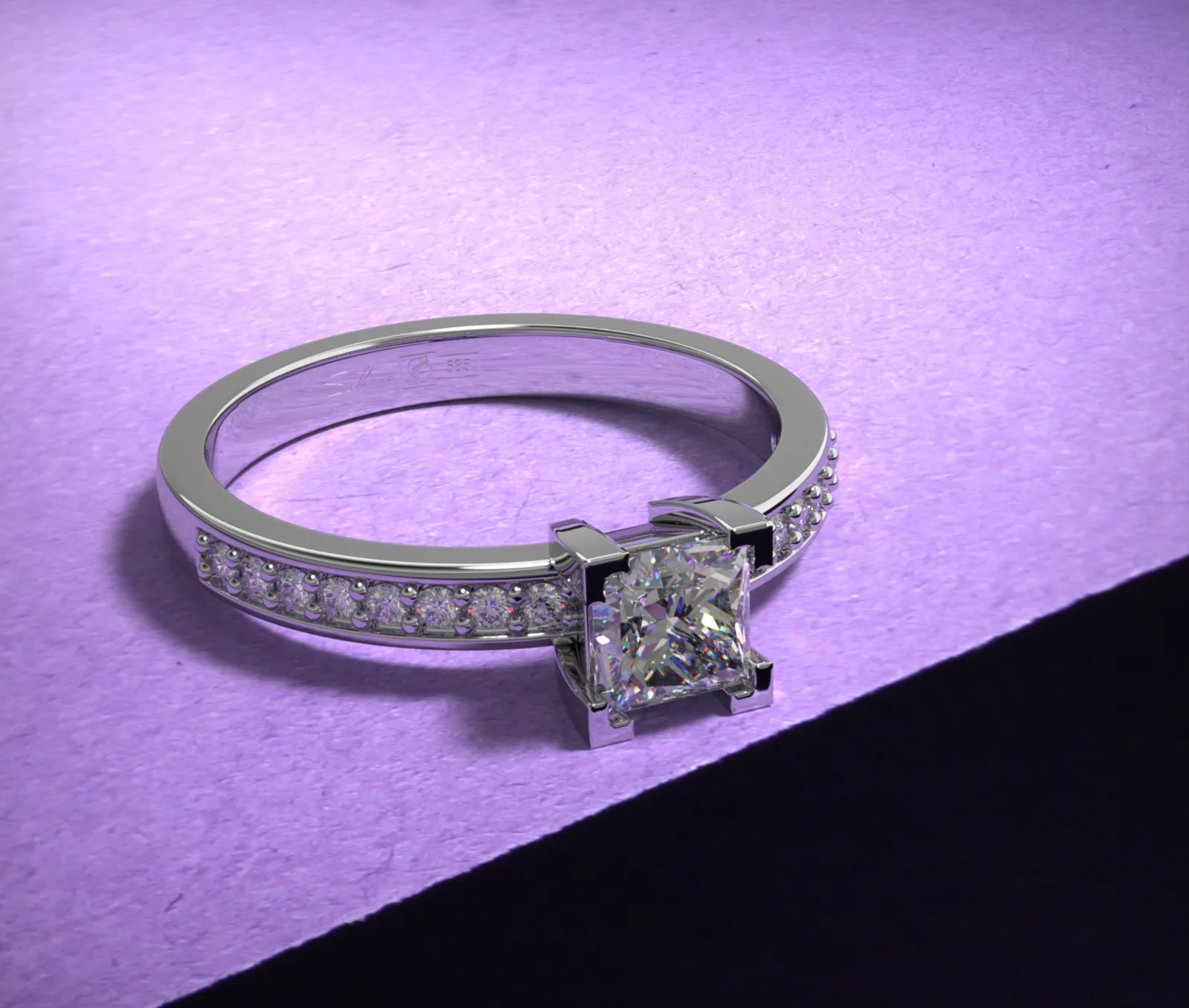 Square diamond ring on a violet studio surface