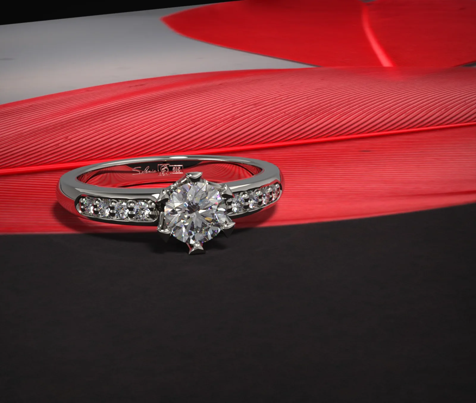 Diamond engagement ring on a red feather