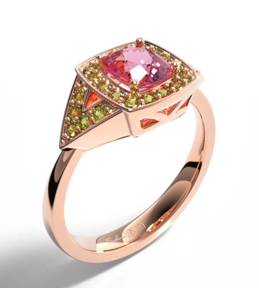 Rose gold ring with pink center stone and green accent gems